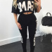 Leisure Round Neck Half Sleeves Letters Printed Black Milk Silk Two-piece Pants Set Leisure Round Neck Half Sleeves Letters Printed Black Milk Silk Two-piece Pants Set