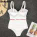 BeAvant V neck sexy bodycon white bodysuits women One-piece summer beach wear playsuit Swimwear casual short jumpsuit body femme