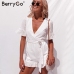 BerryGo Sexy deep v-neck jumpsuit romper women Ruffled hollow out embroidery cotton white playsuit Elegant sashes jumpsuit short