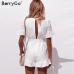 BerryGo Sexy deep v-neck jumpsuit romper women Ruffled hollow out embroidery cotton white playsuit Elegant sashes jumpsuit short