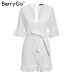 BerryGo Sexy deep v-neck jumpsuit romper women Ruffled hollow out embroidery cotton white playsuit Elegant sashes jumpsuit short